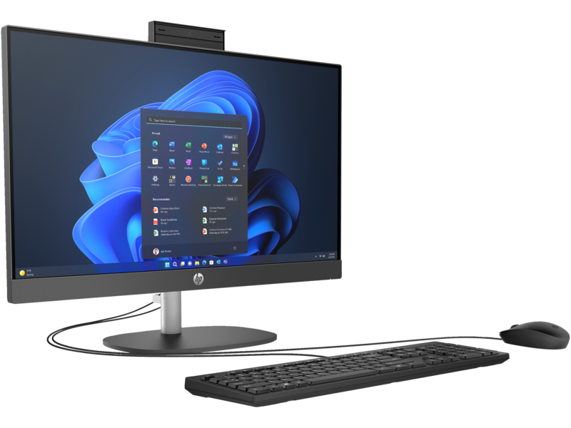 Cluttered laptop desk setup versus a clean all in one desktop setup